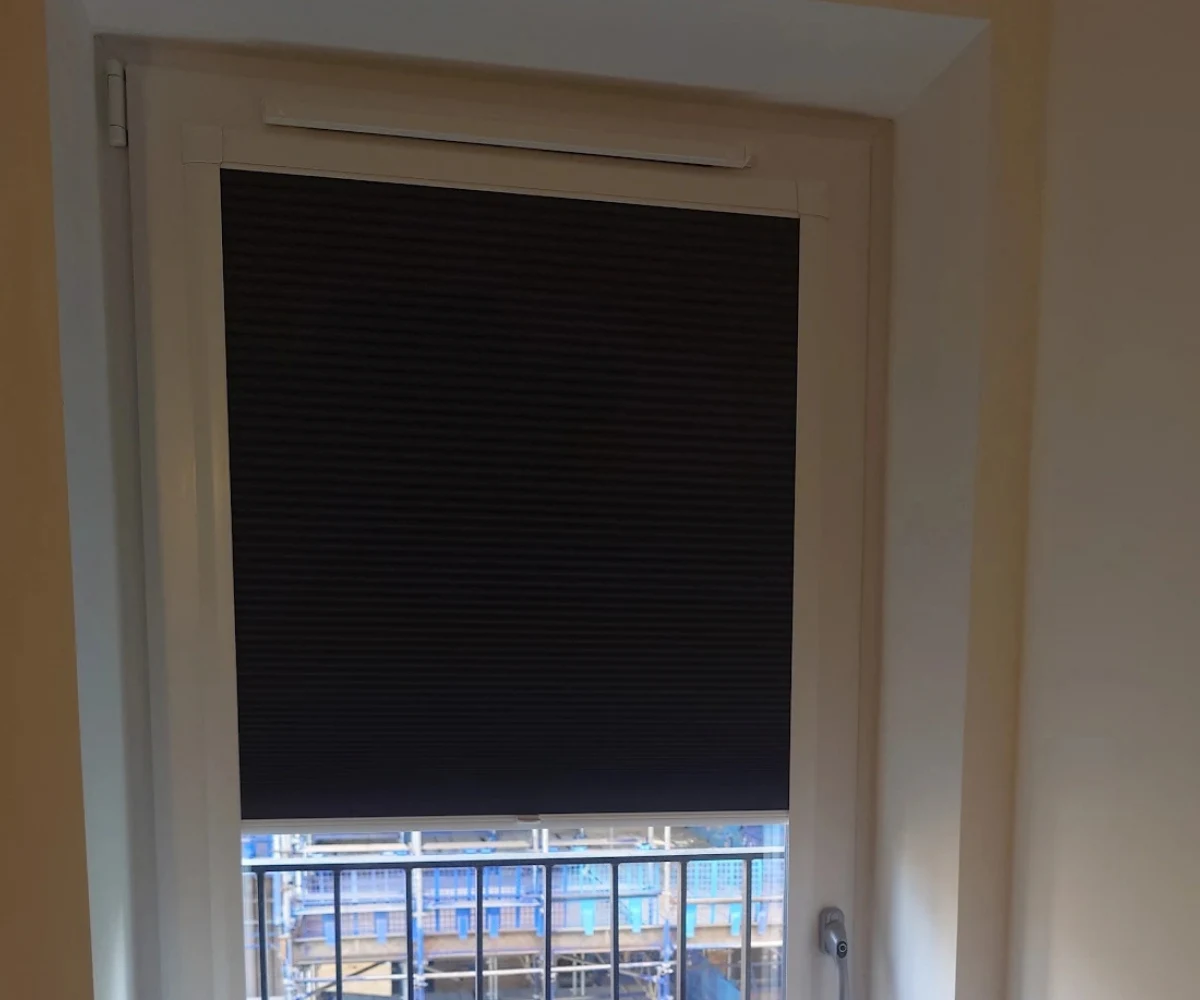 Blackout roller blinds fitted in a Greenfaulds bedroom in Cumbernauld