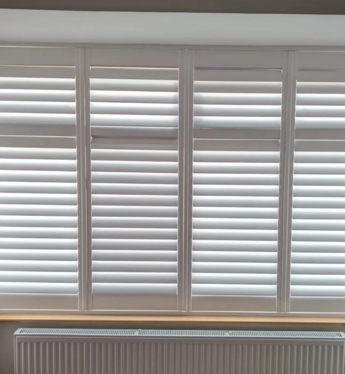 White shutter blinds fitted to a kitchen window in Bridge of Allan near Stirling