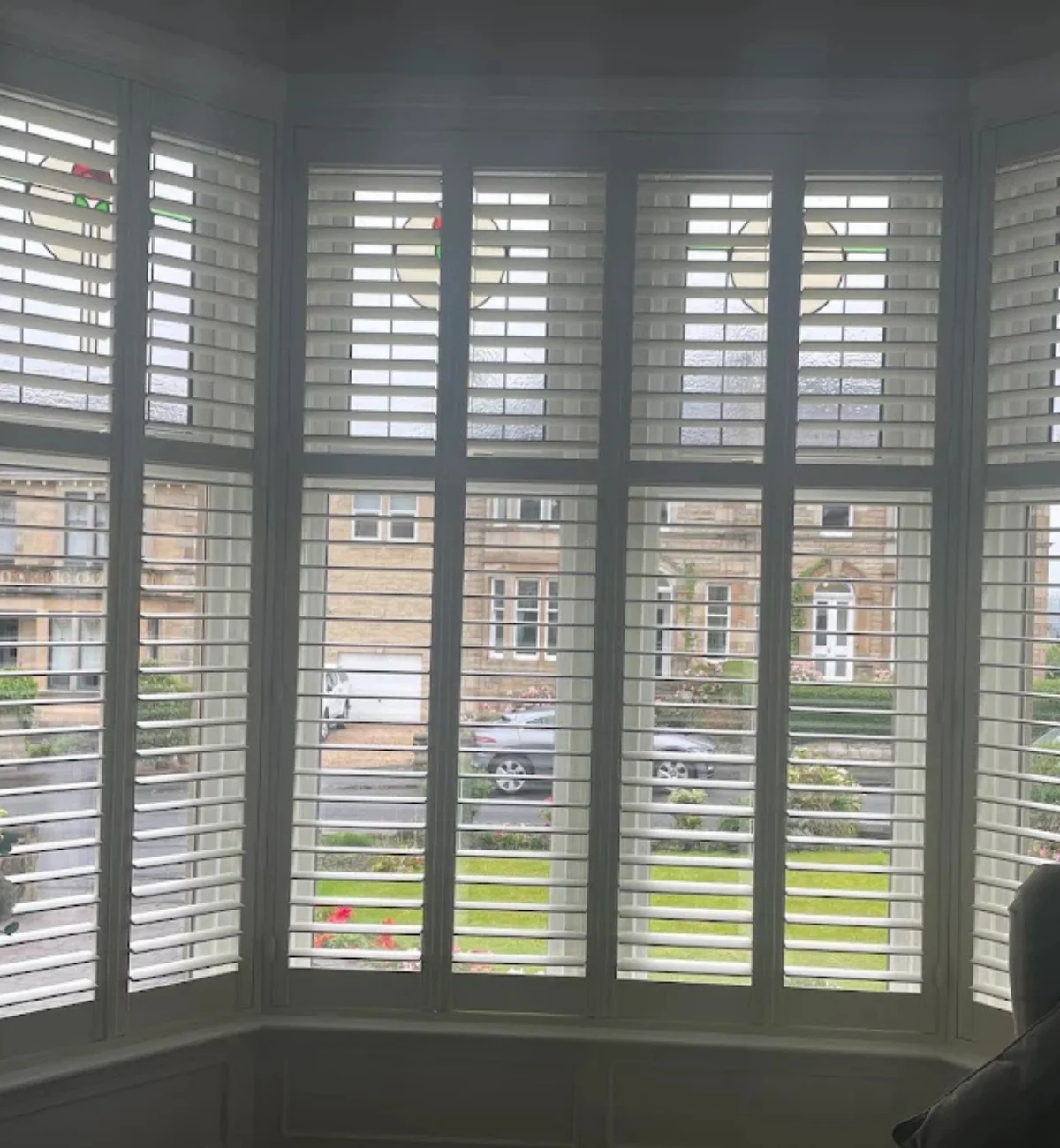 White plantation shutter blinds fitted to a bay window in Falkirk