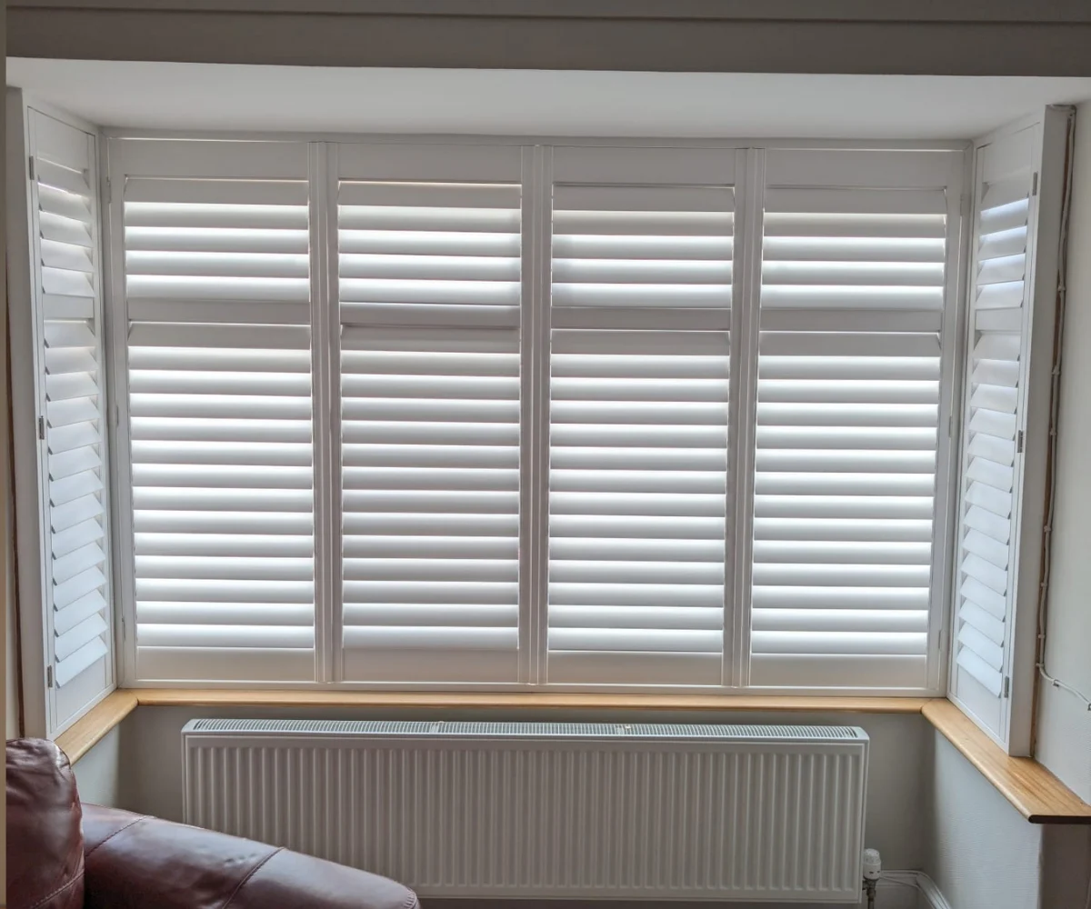 White window shutters fitted to a bay window in Kildrum, Cumbernauld